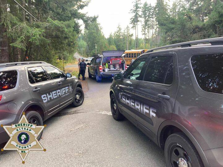 Officers remain on the scene of the intersection of SW Sidney and Spruce. The school bus involved in the wreck can be seen in the background. Courtesy Photo