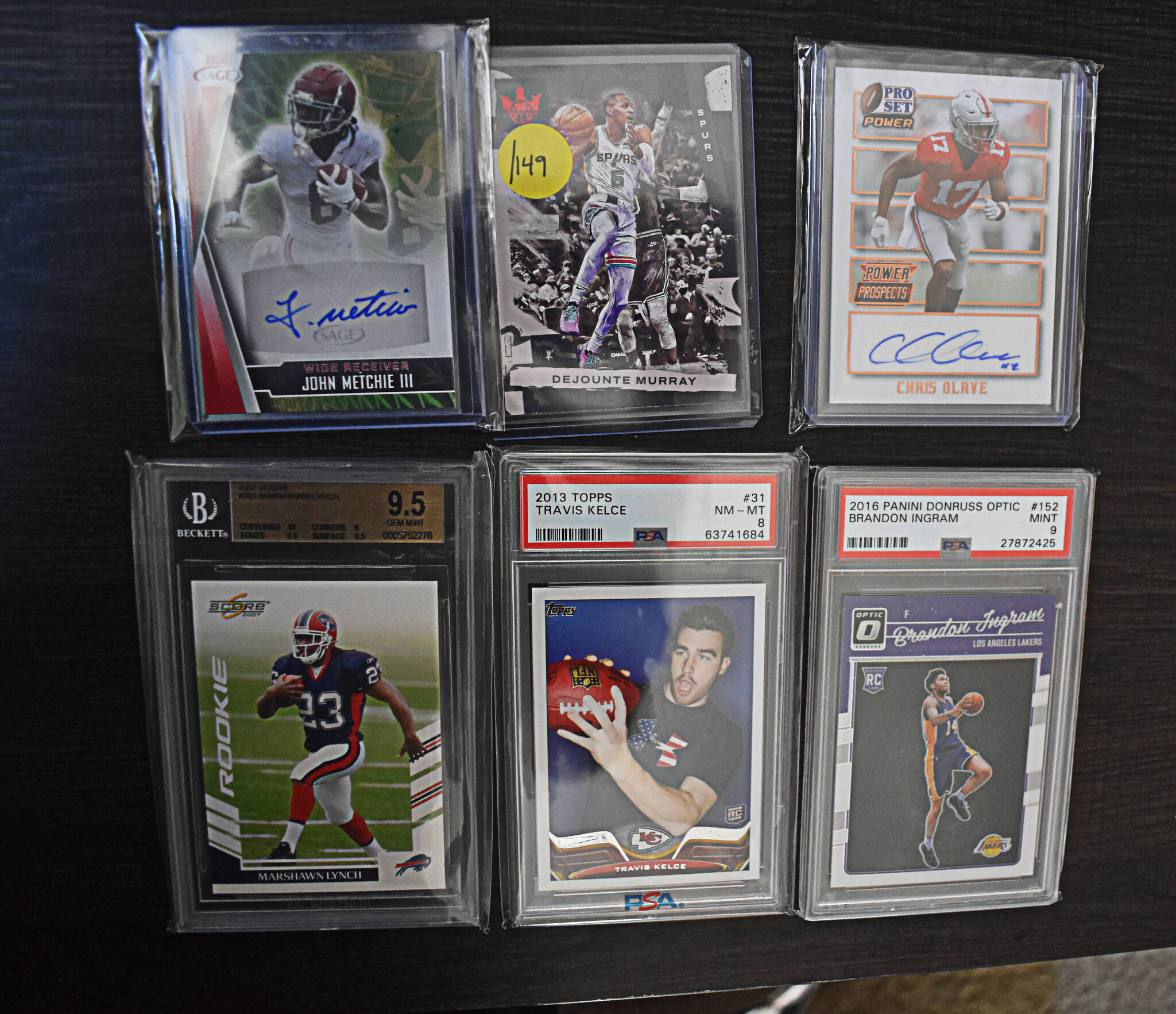 Some of the newest cards of the collection include a rookie Marshawn Lynch football card and an autographed NFL rookies card.