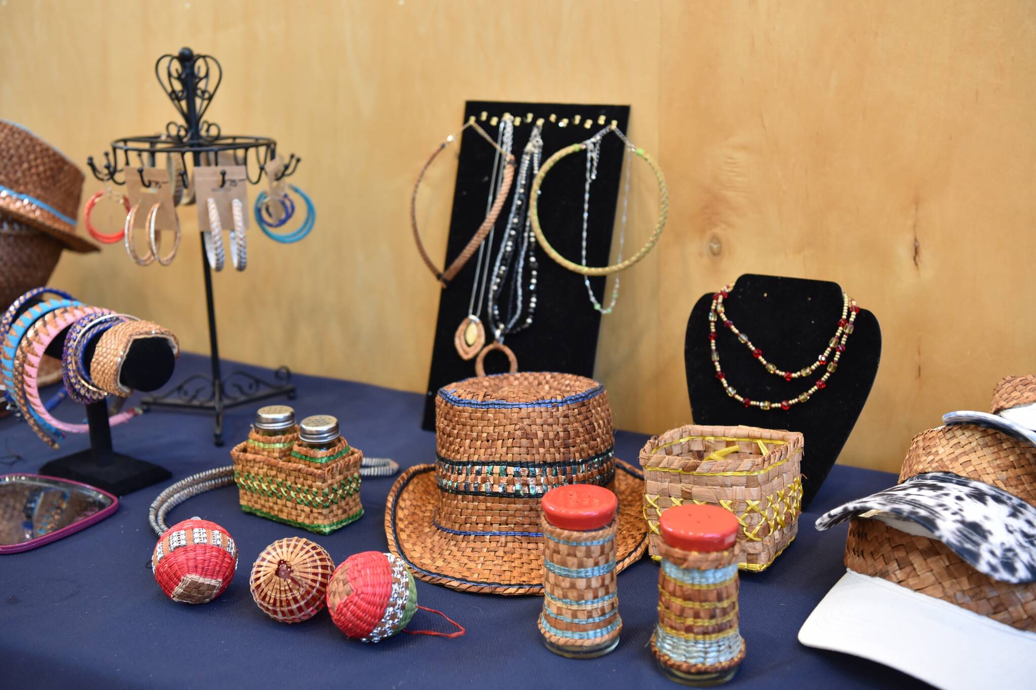 Jewelry and accessories made from woven cedar for sale.
