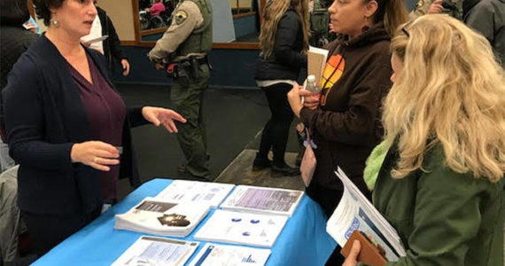 Mike De Felice/Kitsap News Group
Kristen Jewell talks with visitors about the homeless shelter coming to Port Orchard.