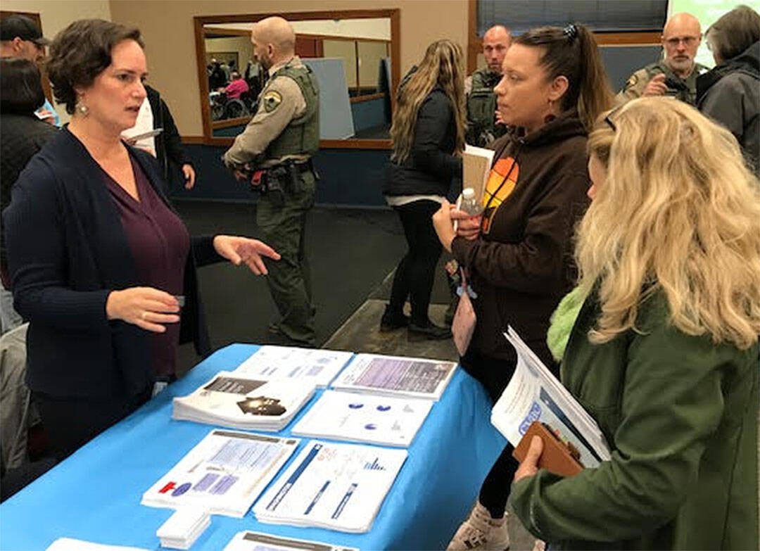 Mike De Felice/Kitsap News Group
Kristen Jewell talks with visitors about the homeless shelter coming to Port Orchard.