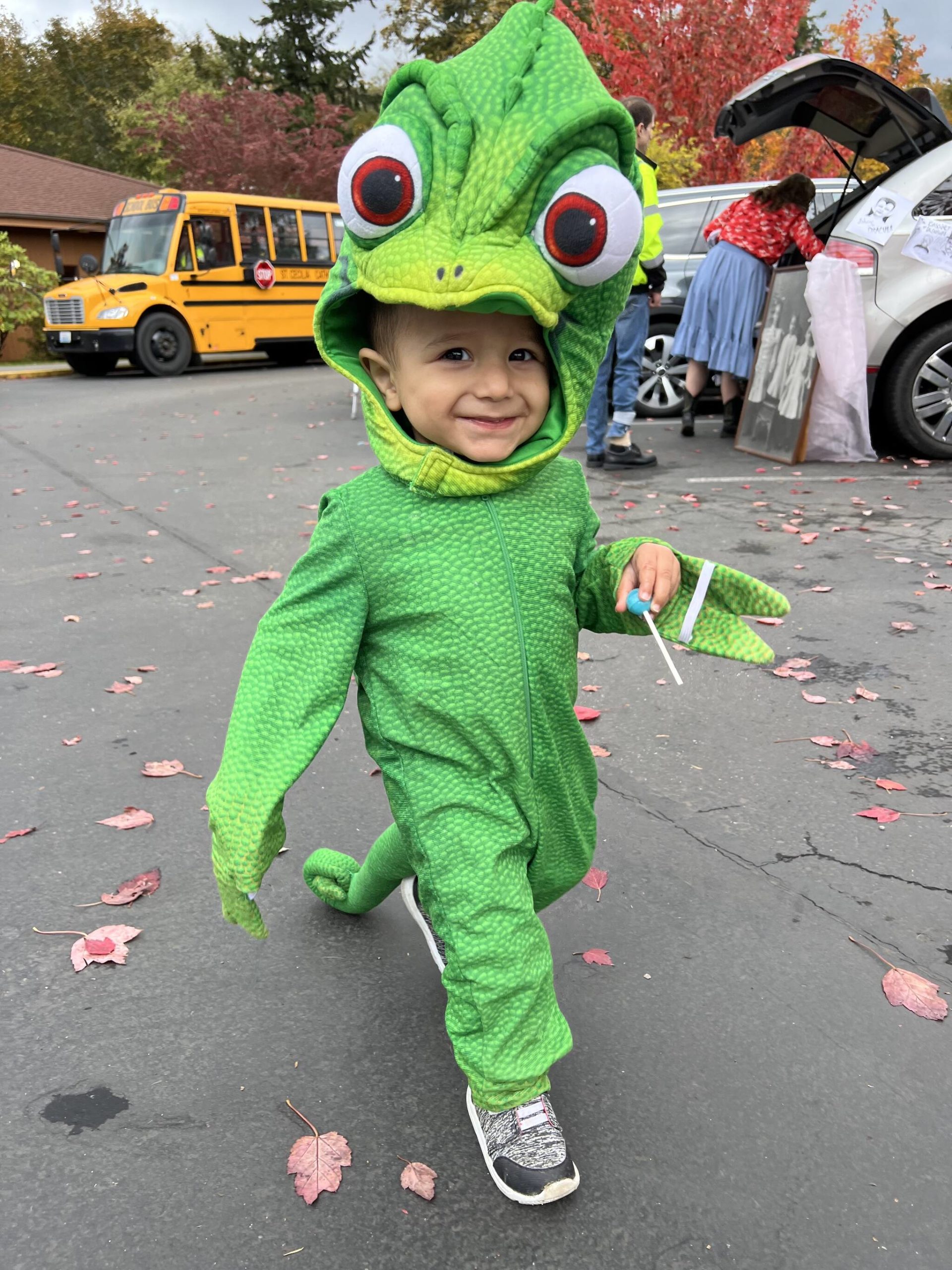 18-month-old Elijah Hernandez enjoys the Halloween event at St. Cecilia Catholic School.