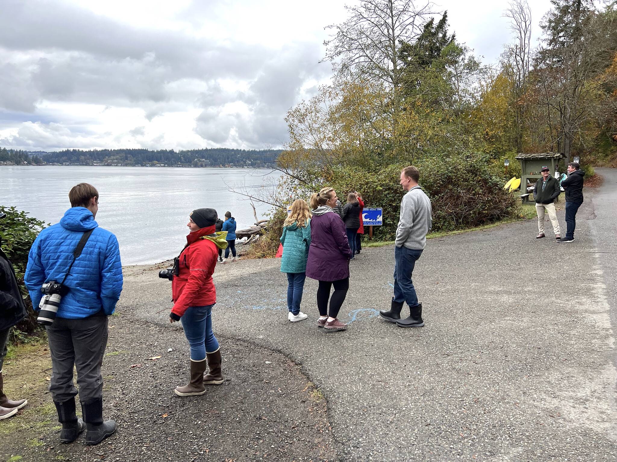 A dozen marine animal advocates, including state Sen. Christine Rolfes, members of SR3 and a NOAA representative, attend the release of the seal pups on Bainbridge Island.
