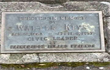 A plaque at the bottom of the flagpole honors Walter Keys.