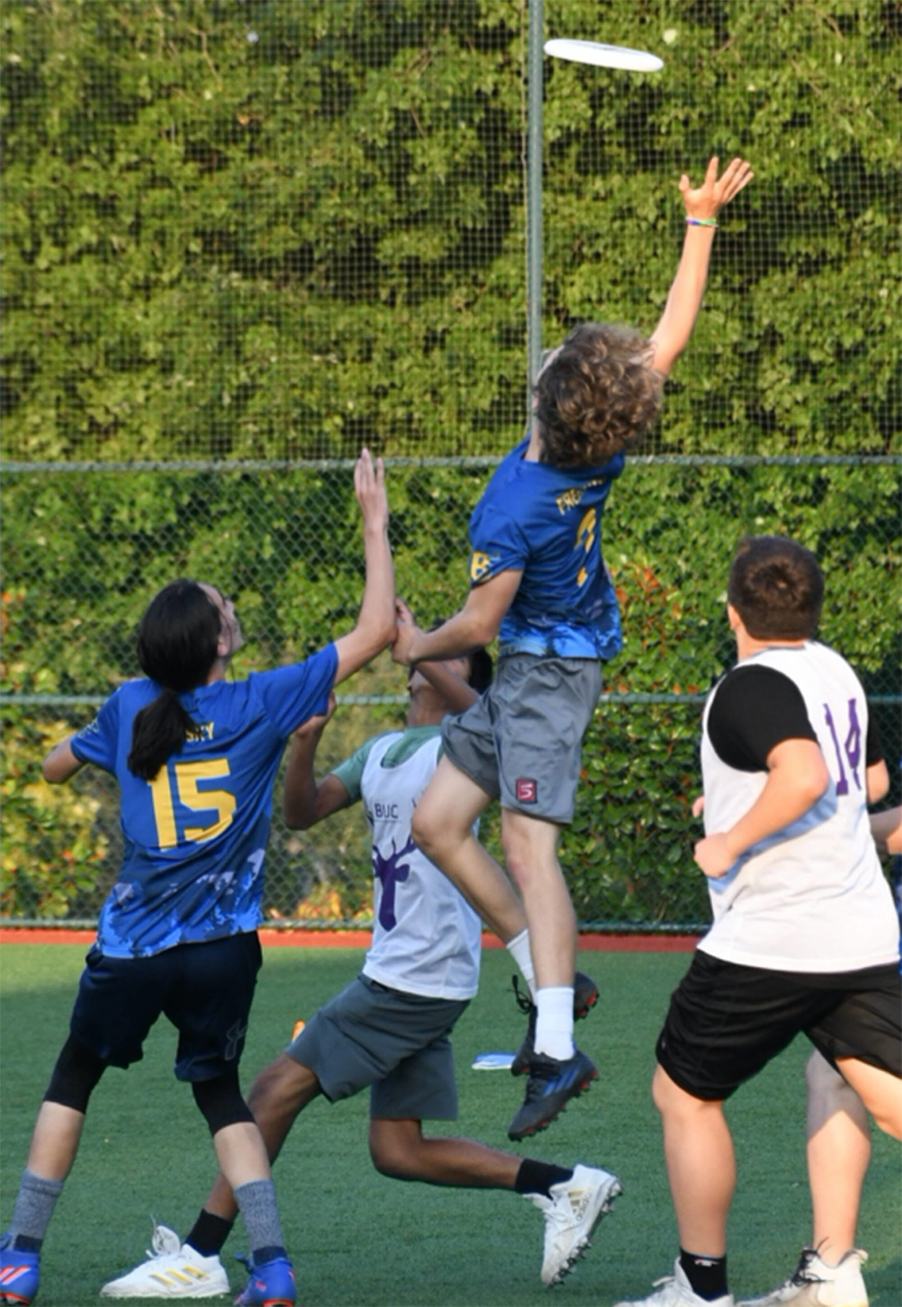 Spencer Freeman skies high to grab a disc against Mercer Island High School, in the divisional playoff game to go to the state tournament.