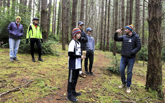 Courtesy Photo
Mike Blossom shows visitors the terrain of the bike park.
