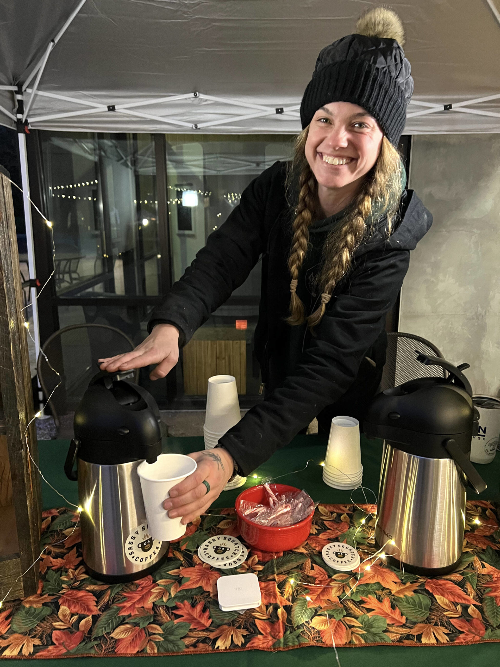 Lauren Petush pumps samples of Sassy Squatch Coffee for visitors.