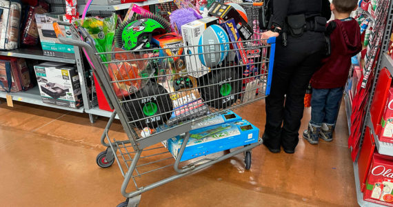 Police shop for presents with children at the Poulsbo Walmart Dec. 3. Courtesy Photos