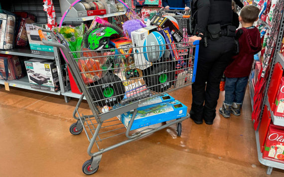 Police shop for presents with children at the Poulsbo Walmart Dec. 3. Courtesy Photos