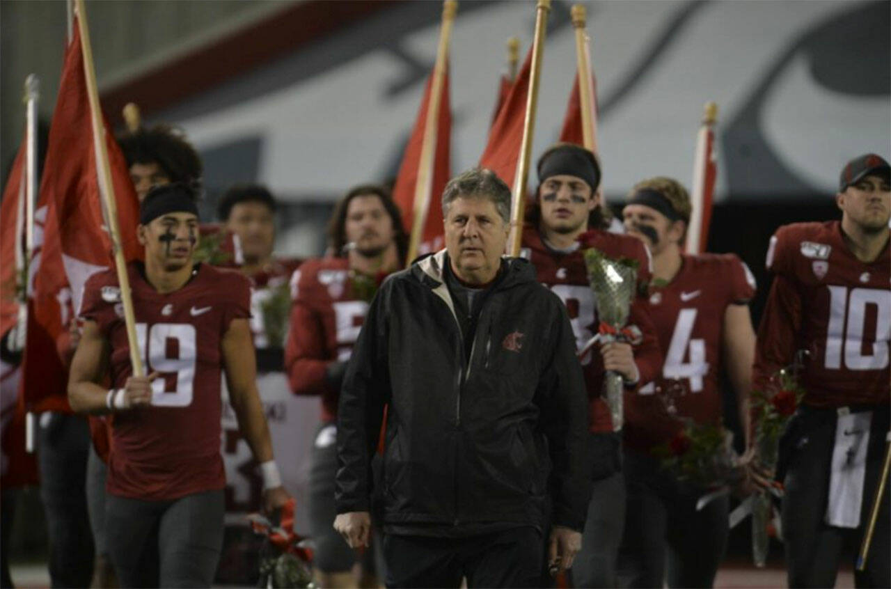 Mike Leach leading his team onto the field on Senior Night.