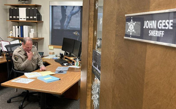 Sheriff John Gese works in his office just before Christmas. Courtesy Photo