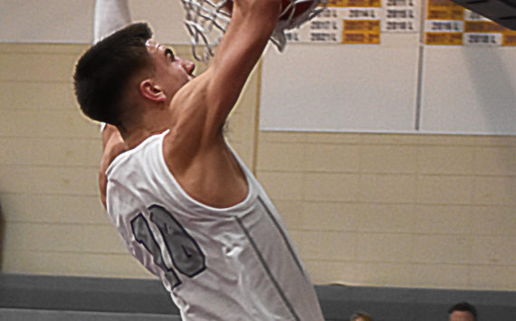 Cade Orness finished the game with three dunks against Kingston. Nicholas Zeller-Singh/Kitsap News Group