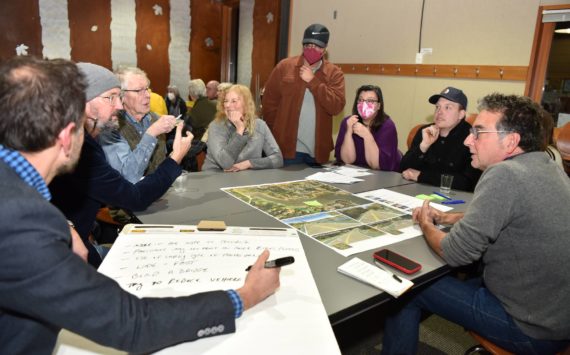 Public Works director Chris Wierzbicki leads a group discussion through the options under consideration for the non-motorized path proposed along Wyatt Way and Eagle Harbor Drive. Nancy Treder/Kitsap News Group