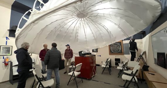 Nancy Treder/Kitsap News Group
Members of the Battle Point Astronomical Association work under the cloth dome in the John Rudolph Planetarium to prepare the projector for the next show March 11.