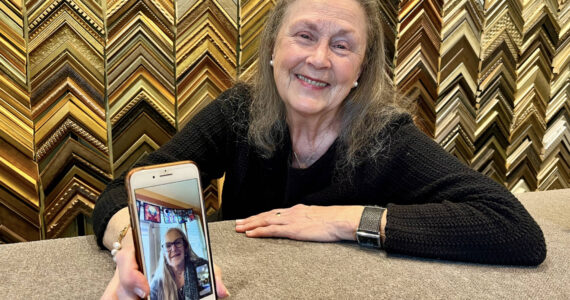 Julie Ulrich chats with her longtime friend, Leigh Ann Giles at her frame gallery in Fletcher Bay which she started 30 years ago. Nancy Treder/Kitsap News Group Photos