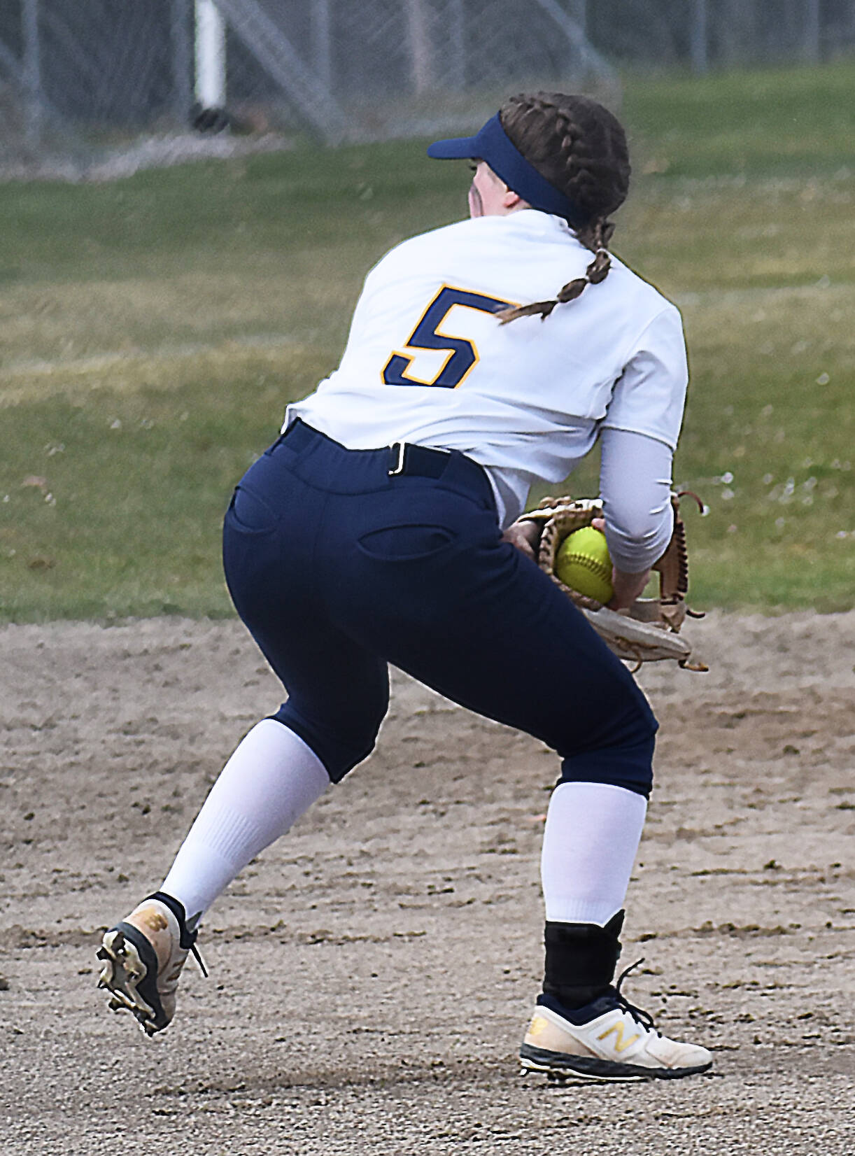 Brearley Jayne-Curfman snags the ball before throwing for the force out.