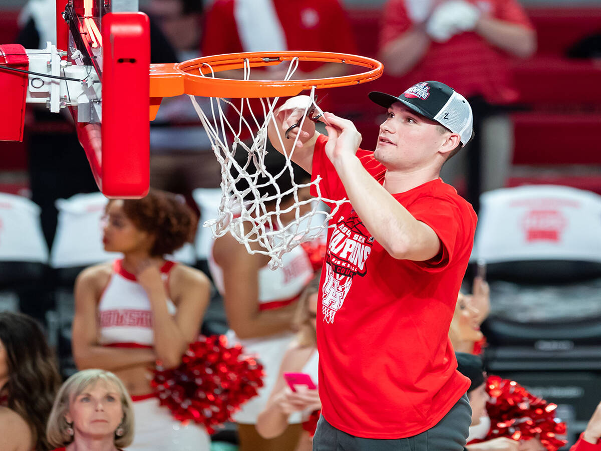 Cole Rabedeaux cuts down the net after taking part in March Madness the past few seasons.