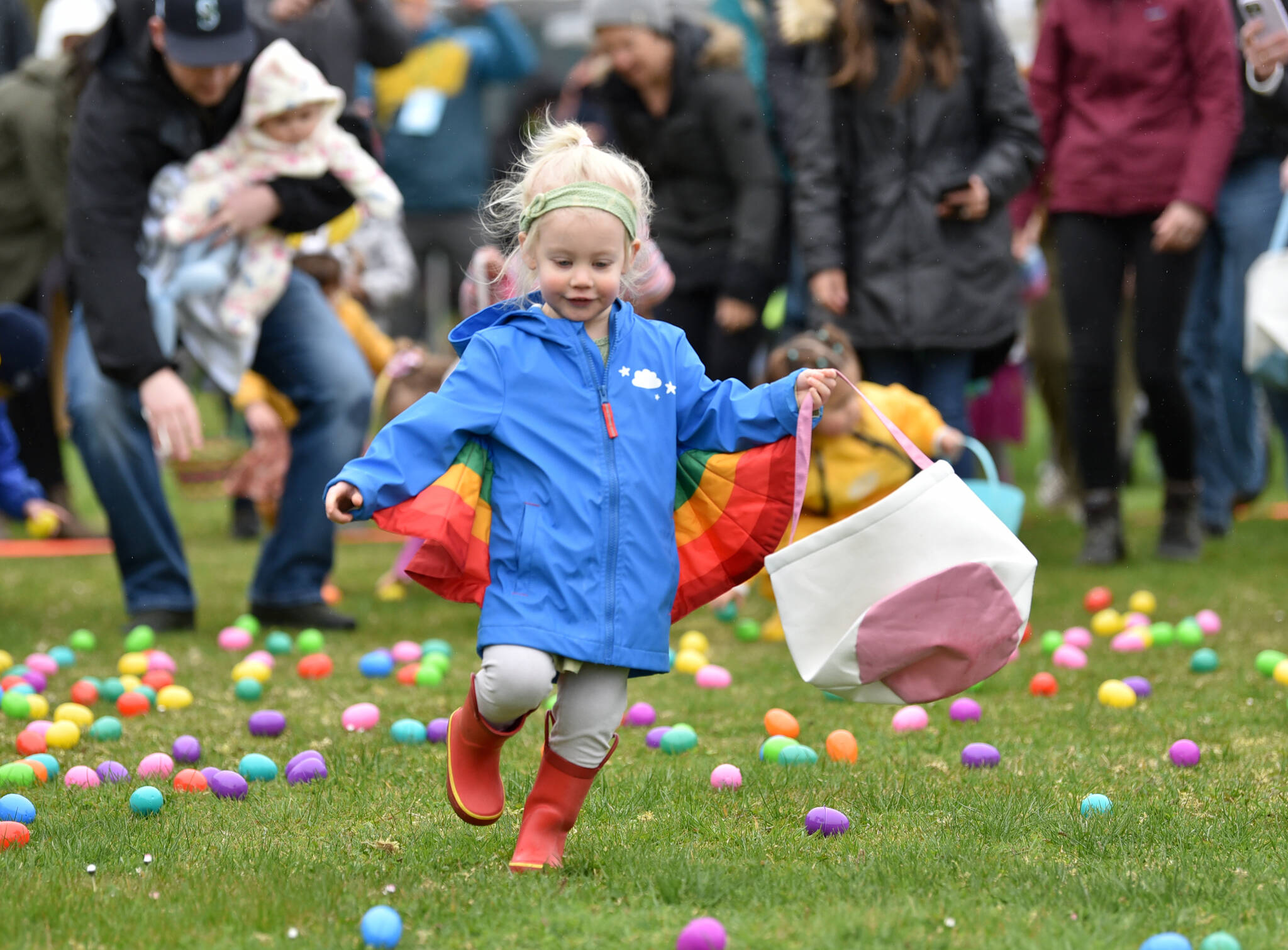 Livvia Lynch (3) runs onto the field during the Easter Egg Dash at Woodward Middle School.