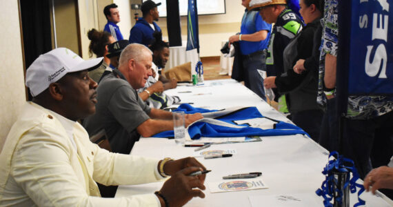 Fans line up to get autographs of current and former Seahawks players. Nicholas Zeller-Singh/Kitsap News Group Photos