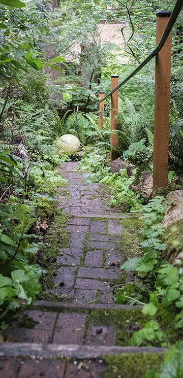 Visitors walk on a picturesque trail through the property.