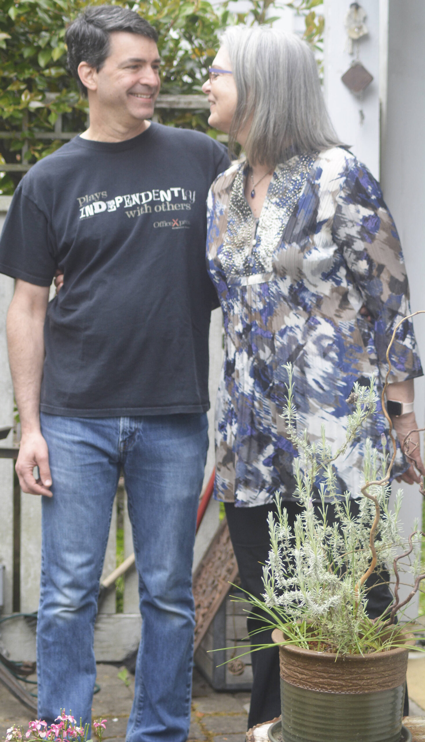Leslie Schneider and partner Jason in their tiny backyard at the co-housing development.