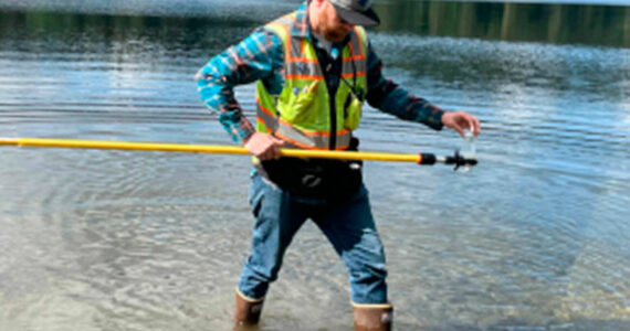 Kitsap County courtesy photos 
A worker checks for fecal bacteria, toxic cyanobacteria (blue-green algae), and other hazards that can make people sick in Kitsap swimming beaches and lakes.