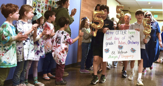 Ordway Elementary School students line the hall and cheer on the fourth-graders for their accomplishments on the last day of school as they move on up to fifth grade in their 'Clap Out' ceremony June 22.  Then the 'graduates' move outside where parents, families and friends join in on the cheers, along with teachers and students. Nancy Treder/Kitsap News Group Photos