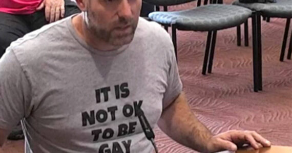 Tyler Shuey/Kitsap News Group 
Daniel Charles Svoboda wears a shirt stating “It is not ok to be gay” at the July 5 Poulsbo City Council meeting.