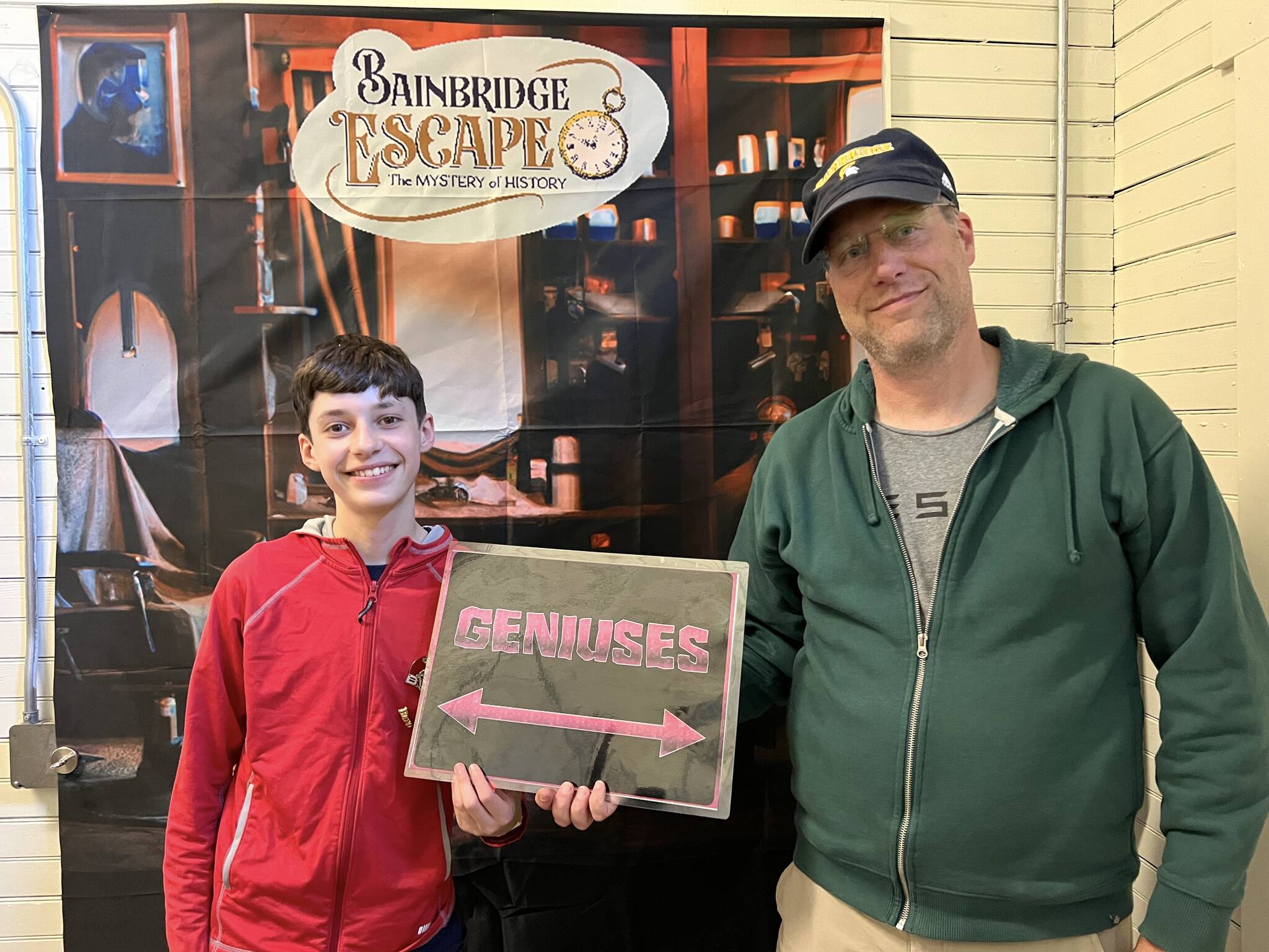 Amateur sleuths Elijah and Doug Treder take a selfie after experiencing the ‘mystery of history’ in the escape room on Winslow Way.