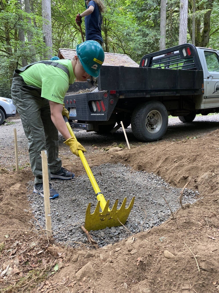 A Bainbridge teen works on a Student Conservation Corps project that installed two new boot brush stations at Blakely Harbor Park and Gazzam Lake Nature Preserve, helping curb the spread of invasive weed seeds from our boots and shoes.
