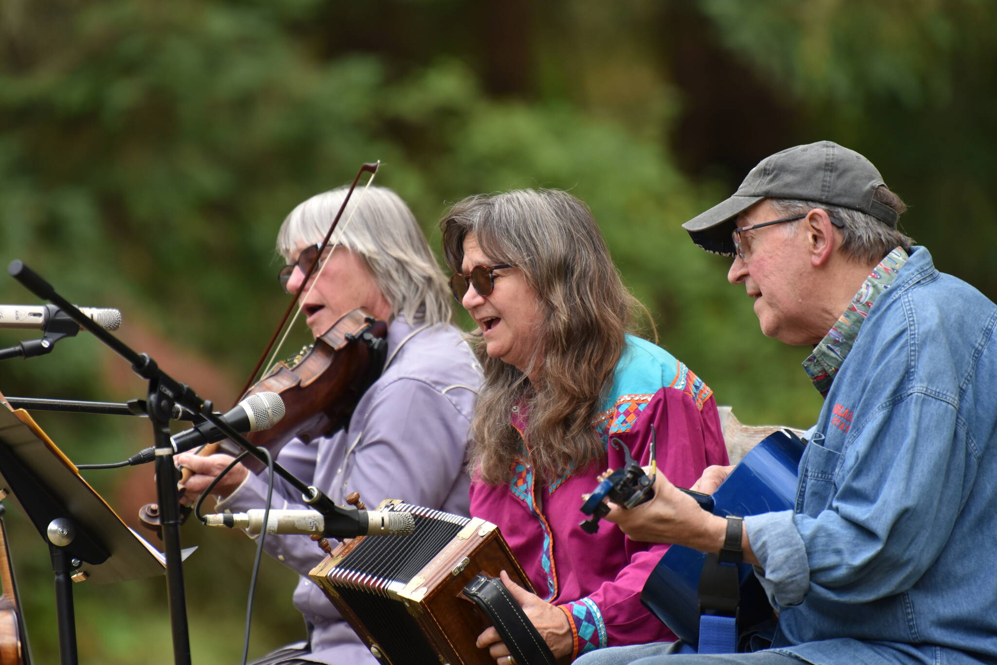 Members of the WHOZYAMAMA band perform a community concert at the Moritani Preserve.