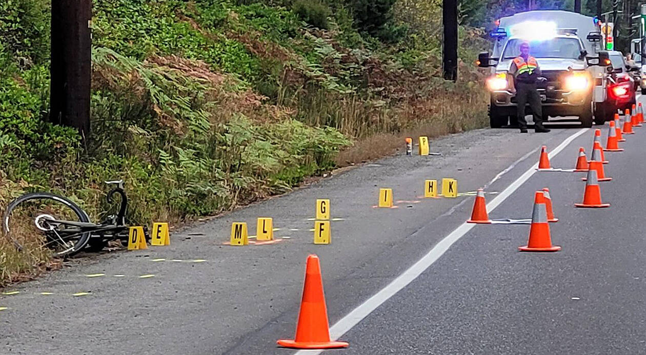 KCSO courtesy photo  
A bicycle lies on the side of the road in Hansville following a hit-and-run collision early Sept. 19 that resulted in critical injuries to a male cyclist who was airlifted to Harborview Medical Center in Seattle. The suspect has been arrested.