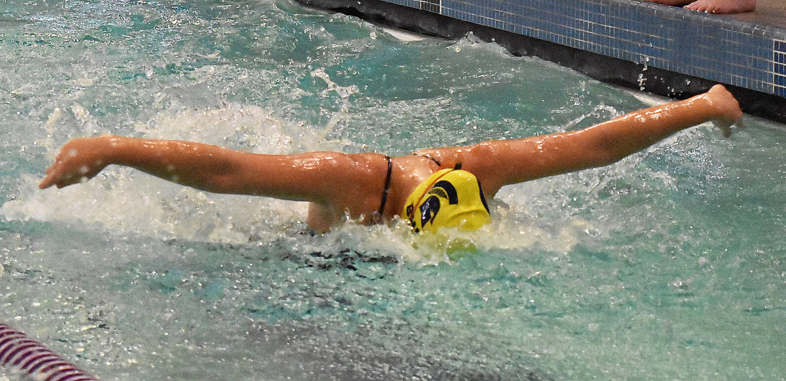 Spartan Evelyn Atchison competes in the 200-yard medley relay.