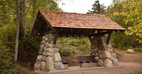 Nancy Treder/Kitsap News Group Photos
A new covered memorial shelter overlooking Eagle Harbor was installed at Pritchard Park privately funded by the Parsons family, in honor of their daughter Carrie and other families who have prematurely lost their children. The new rock-and-timber bench shelter sits on the bluff overlooking the mouth of Eagle Harbor with a view of the Seattle skyline was designed by Dan Hamlin and David Harry, Bainbridge Metro Parks superintendent.