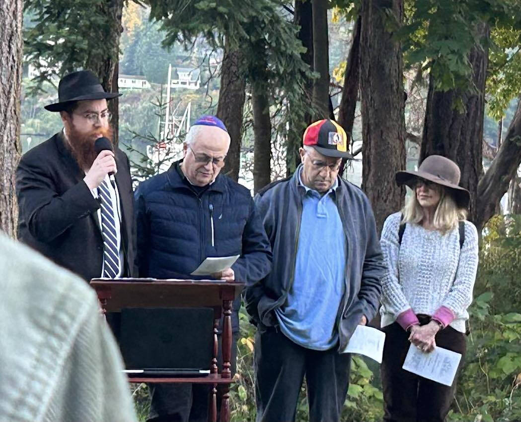 Rabbi Mendy Goldshmid speaks to the community Oct. 12.
