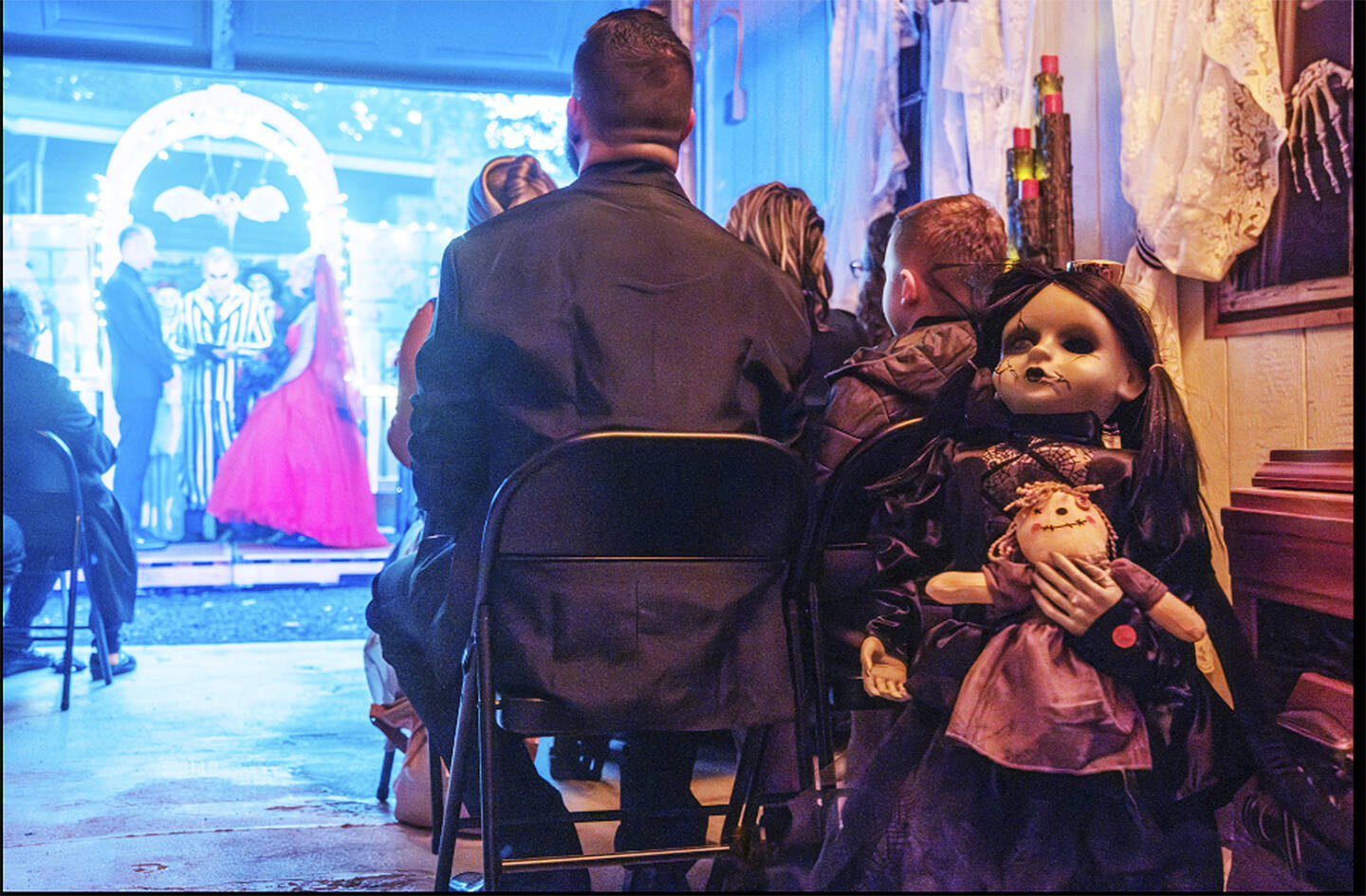 A wedding with a Halloween theme includes all types of costumes.
