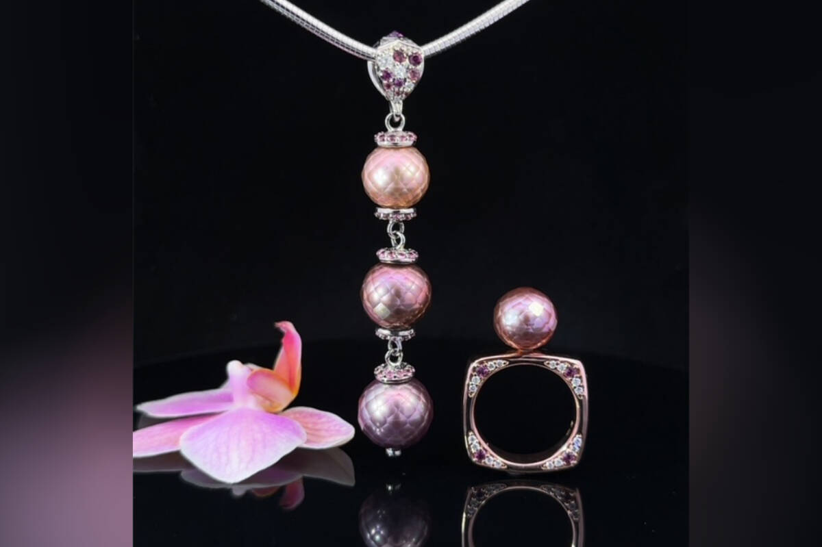 The 3 pearl pendant features 3 natural Edison freshwater pearls. A shimmery copper, rose purple and purple. Accented with Rhodolite Garnets and Diamonds.