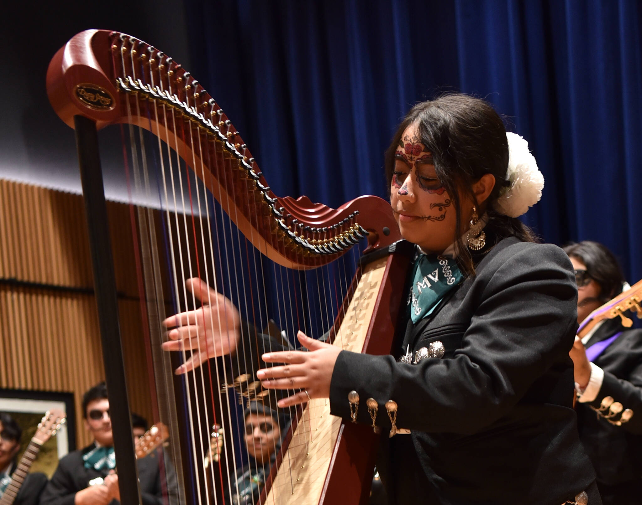 Vivian Rosales plays the harp.
