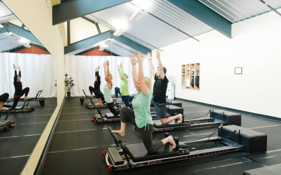 Arlene Harris leads a session at  The Pilates Studio at New Motion on a device known as the Reformer. New Motion Physical Therapy photo