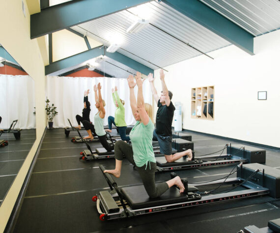 Arlene Harris leads a session at  The Pilates Studio at New Motion on a device known as the Reformer. New Motion Physical Therapy photo