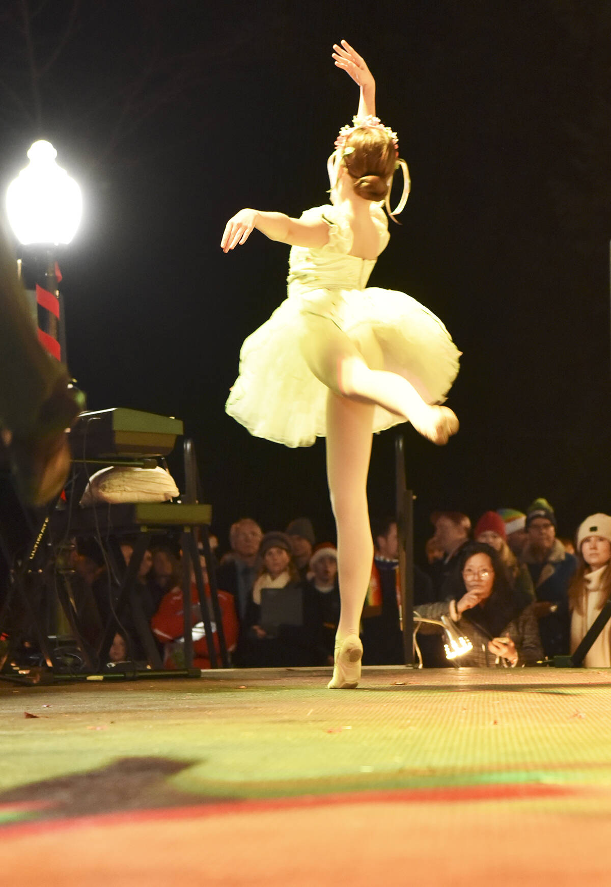 A ballerina delights the crowd with a classic and beautiful performance.