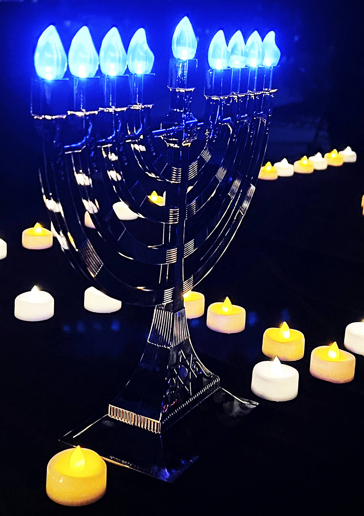 A menorah surrounded by candles honors the Jewish faith.