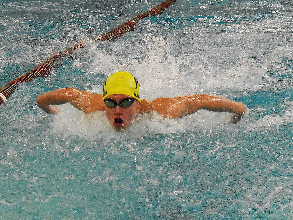 Robbie Nakhuda wins the 50-yard freestyle and 100-yard butterfly for Bainbridge.
