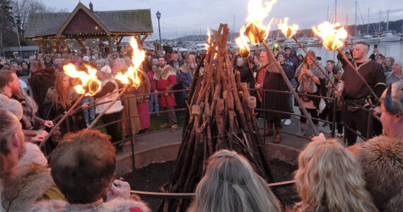 Damon Williams/Kitsap News Group Photos
Vikings from the Sons of Norway get set to light the bonfire on the Poulsbo Waterfront Feb. 10.
