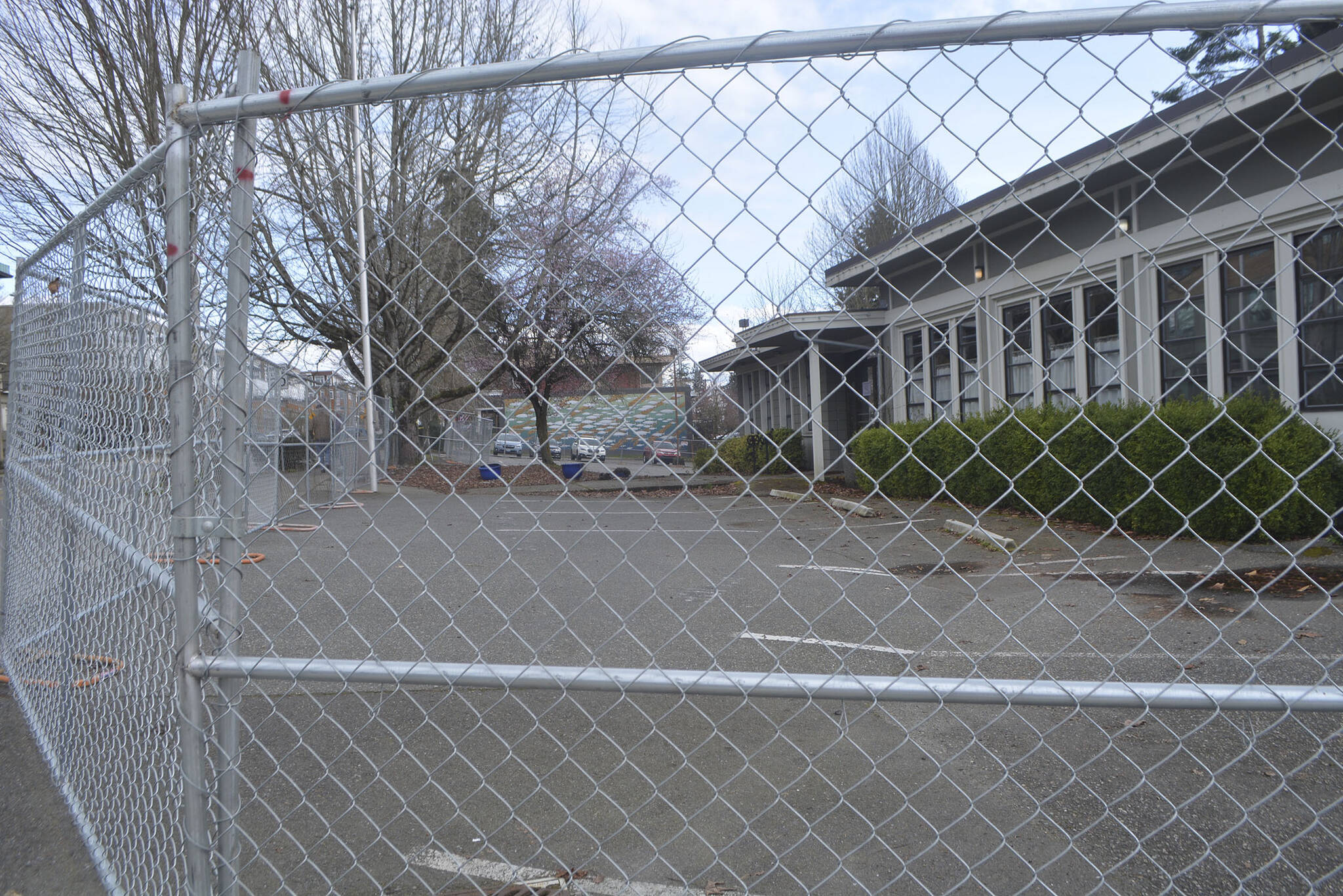 A fence has been placed around the old police station on Bainbridge. The council will look to OK a contract to demolish the building March 12.