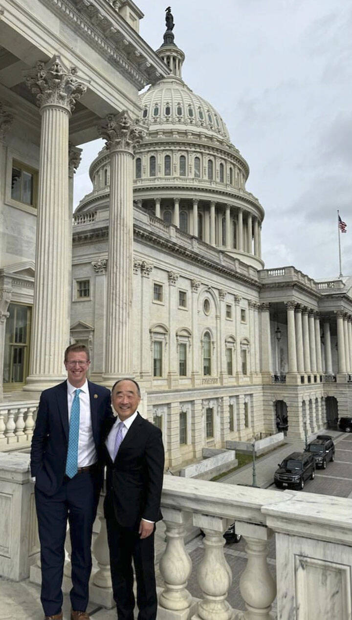 Rep. Derek Kilmer and BI City Councilmember Clarence Moriwaki in front of the Congress building in Washington, D.C.