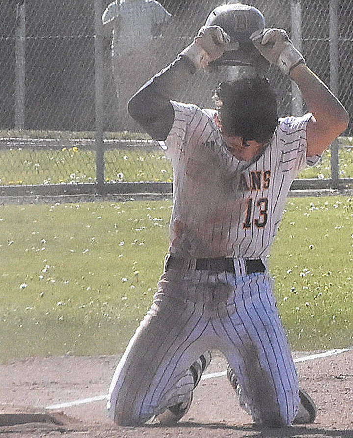 Spartan AJ Larsen shows frustration after being thrown out at third base.