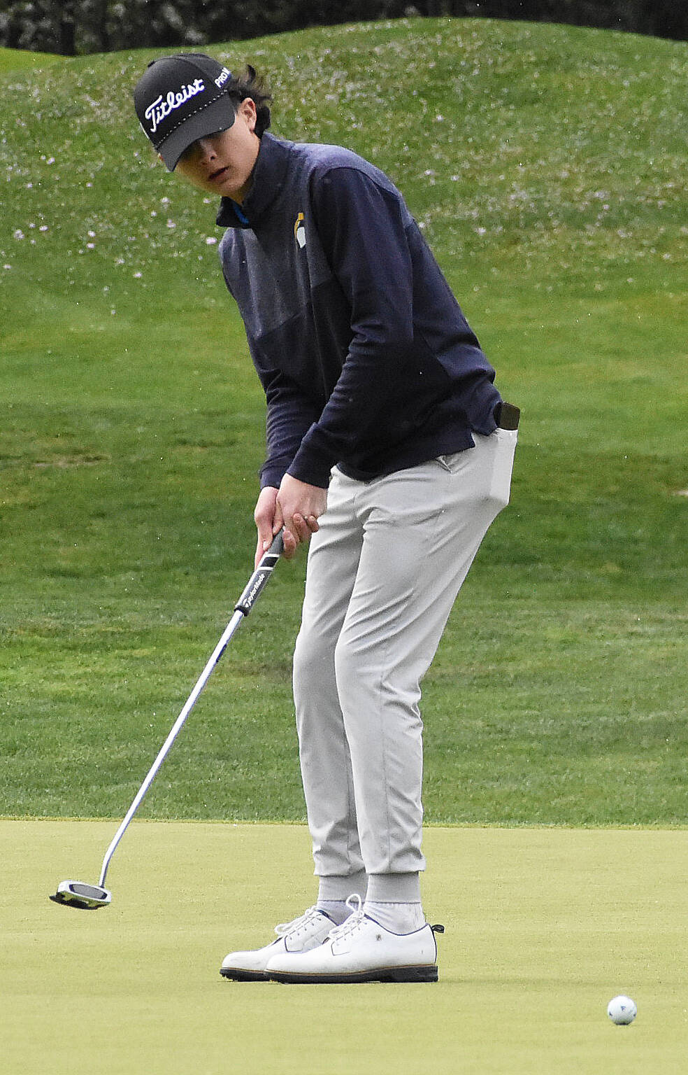 Spartan Sam Patterson putts the ball.