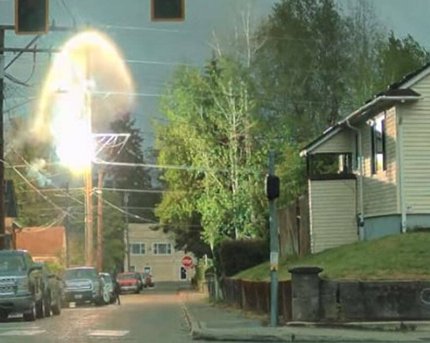 Brandi Marie courtesy photo
A cloud of smoke and fire erupts from a transmission pole in Bremerton in an image captured by eyewitness video footage.