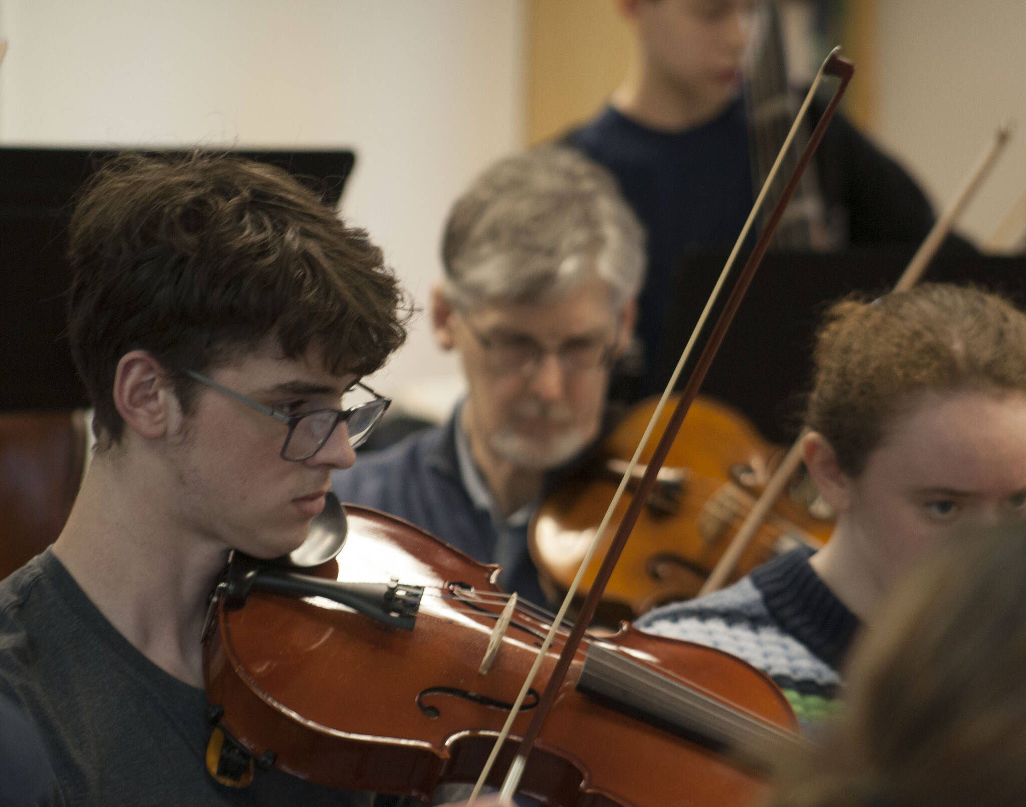 Viola players Gray Nichols and Wes Dyring practice at rehearsal April 12.